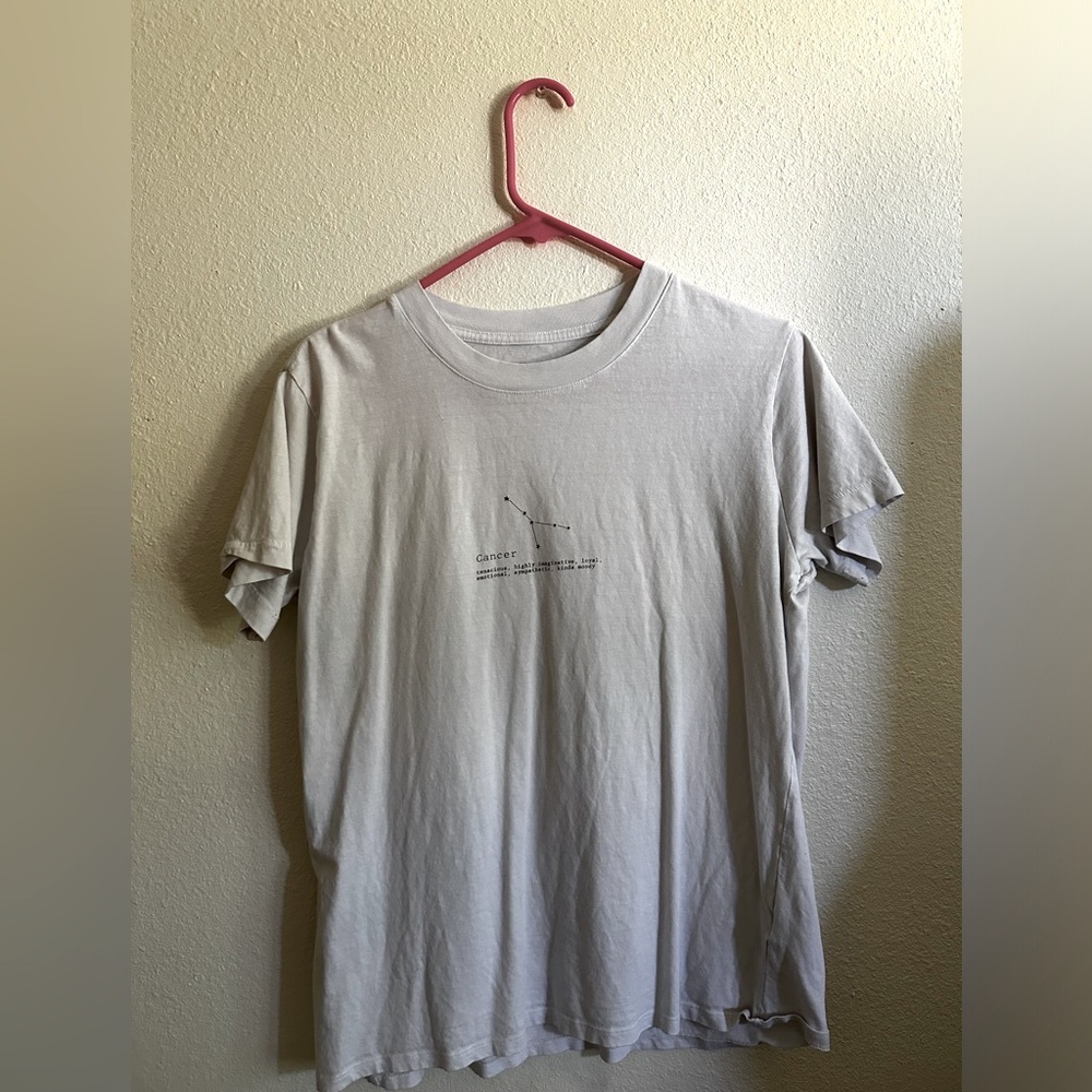 Large white t-shirt with cancer astrology design on the front, from Cotton On